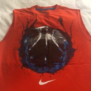 Nike sleeveless orange shirt.